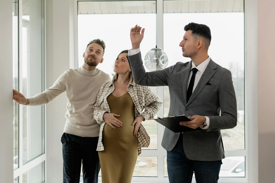Leasing agent showing property to prospective tenants