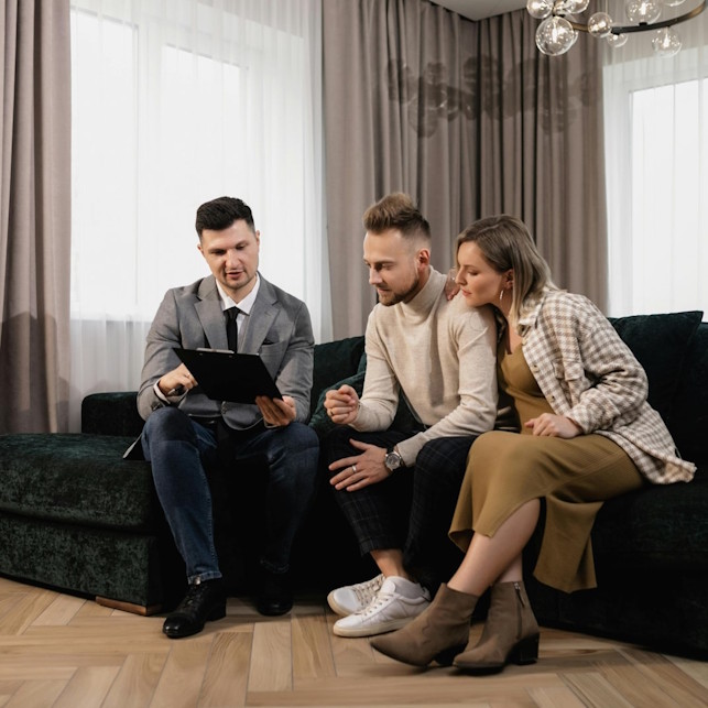 Professional consultation meeting between landlord and tenant placement specialist